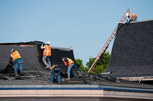 roofing crew at work removing and replacing roof